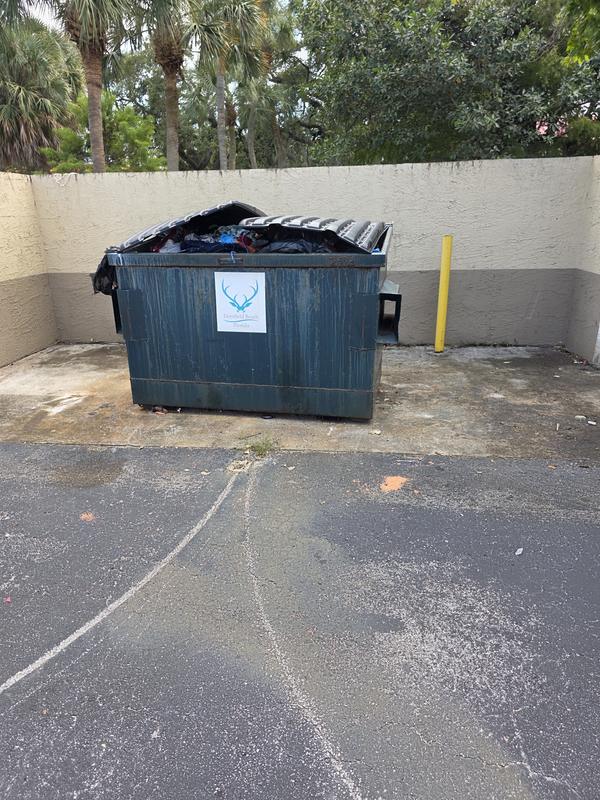 Commercial dumpster enclosure and pavement
