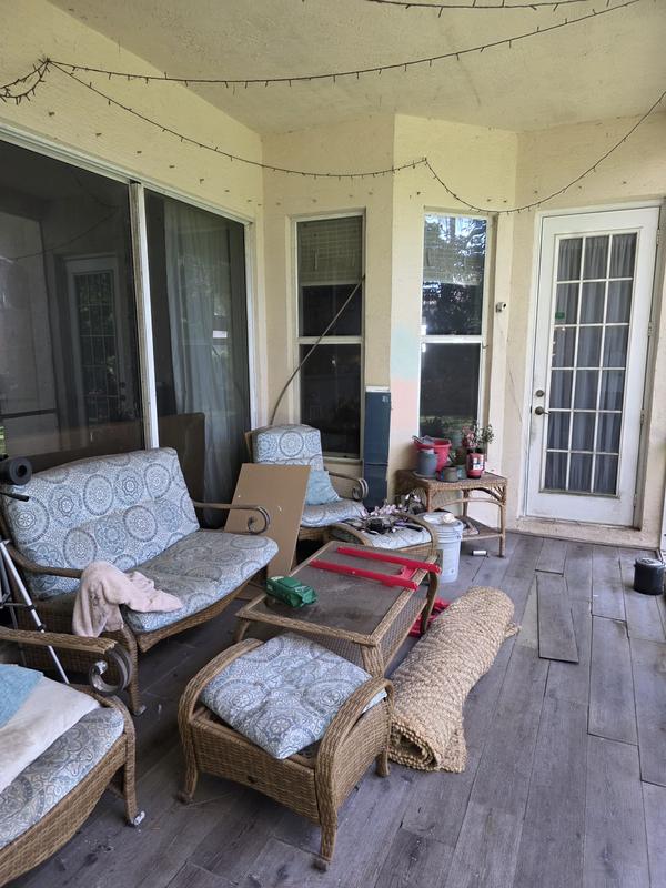 Before: Cluttered screened patio before clean-up